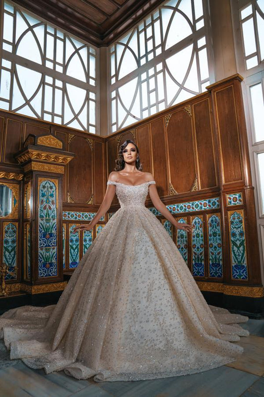 Elegant Long Off-The-Shoulder Wedding Dresses Featuring Sequins and a Slit