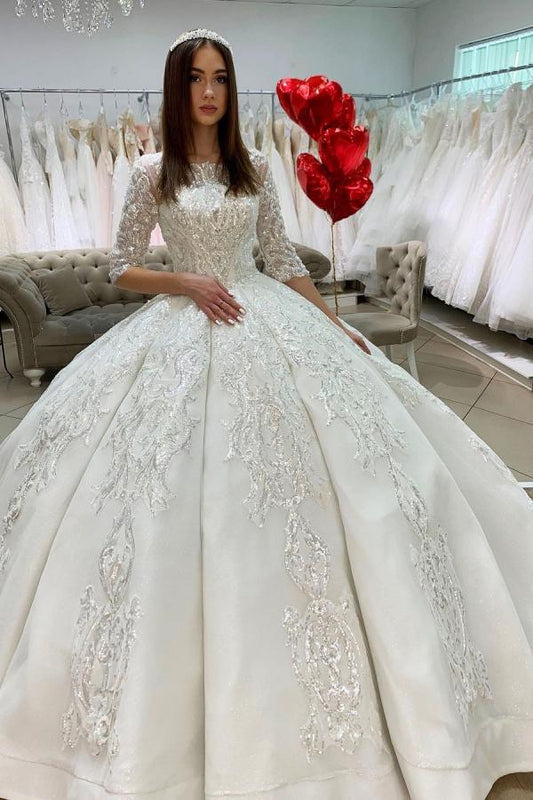 Elegant Satin Princess Bateau Wedding Gown with Long Sleeves and Lace Appliques