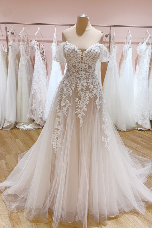 Elegant A-Line Off-the-Shoulder Wedding Gown Featuring a Backless Sweetheart Tulle Train