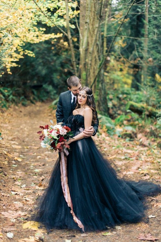 Elegant strapless black A-line wedding gown with lace appliques and tulle