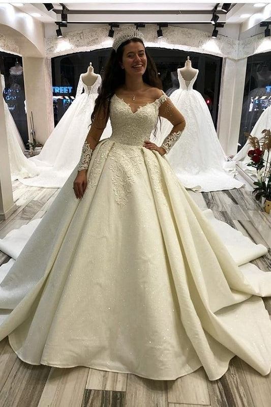 Elegant Sweetheart Princess Wedding Gown with Long Satin Sleeves and Appliques