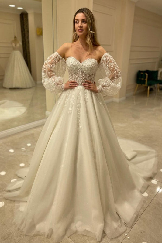 Elegant Sweetheart A-Line Wedding Dress with Backless Design and Lace Appliques