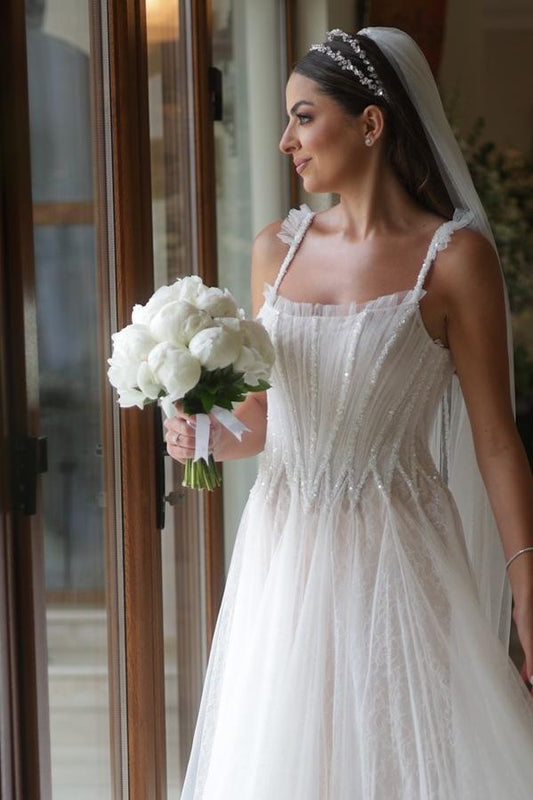 Sleeveless White A-Line Wedding Dress with Elegant Tulle, Spaghetti Straps, Sequins, and Lace
