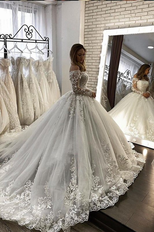 Elegant Off-The-Shoulder Illusion Ball Gown Wedding Dress with Long Sleeves and Appliques