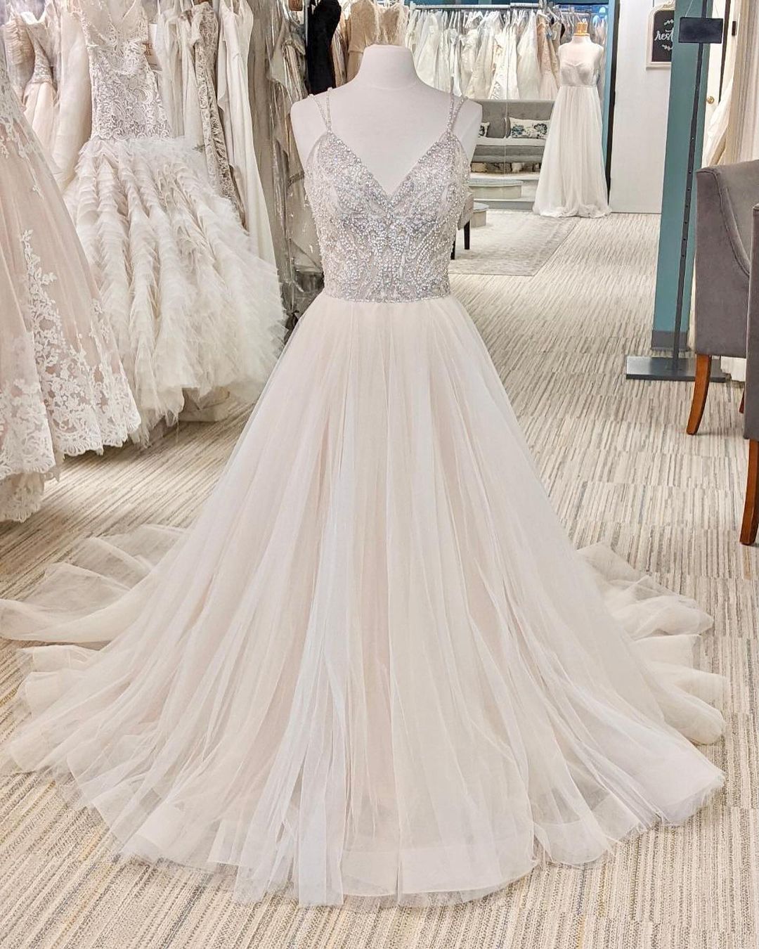 Elegant V-neck A-line Wedding Gown with Backless Design and Pearl Details