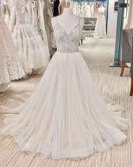 Elegant V-neck A-line Wedding Gown with Backless Design and Pearl Details