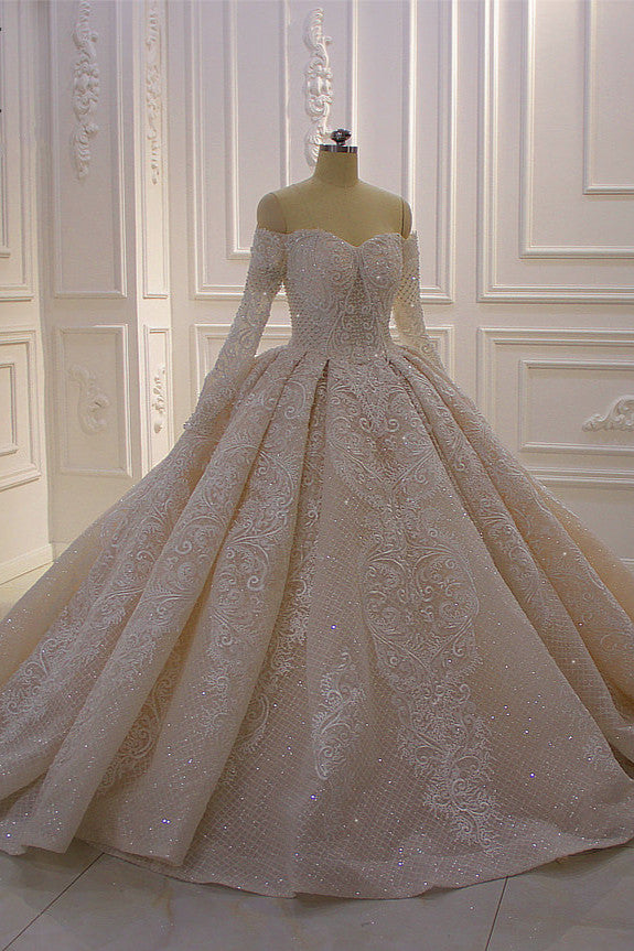 Elegant Off-The-Shoulder Ball Gown Wedding Dress with Lace Appliques and Long Sleeves