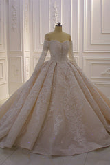 Elegant Off-The-Shoulder Ball Gown Wedding Dress with Lace Appliques and Long Sleeves