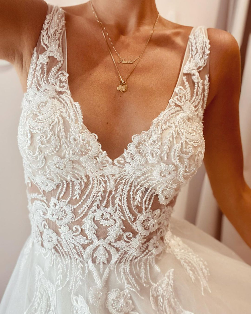 Elegant Backless A-Line Wedding Dress with Deep V-Neck and Lace Appliques