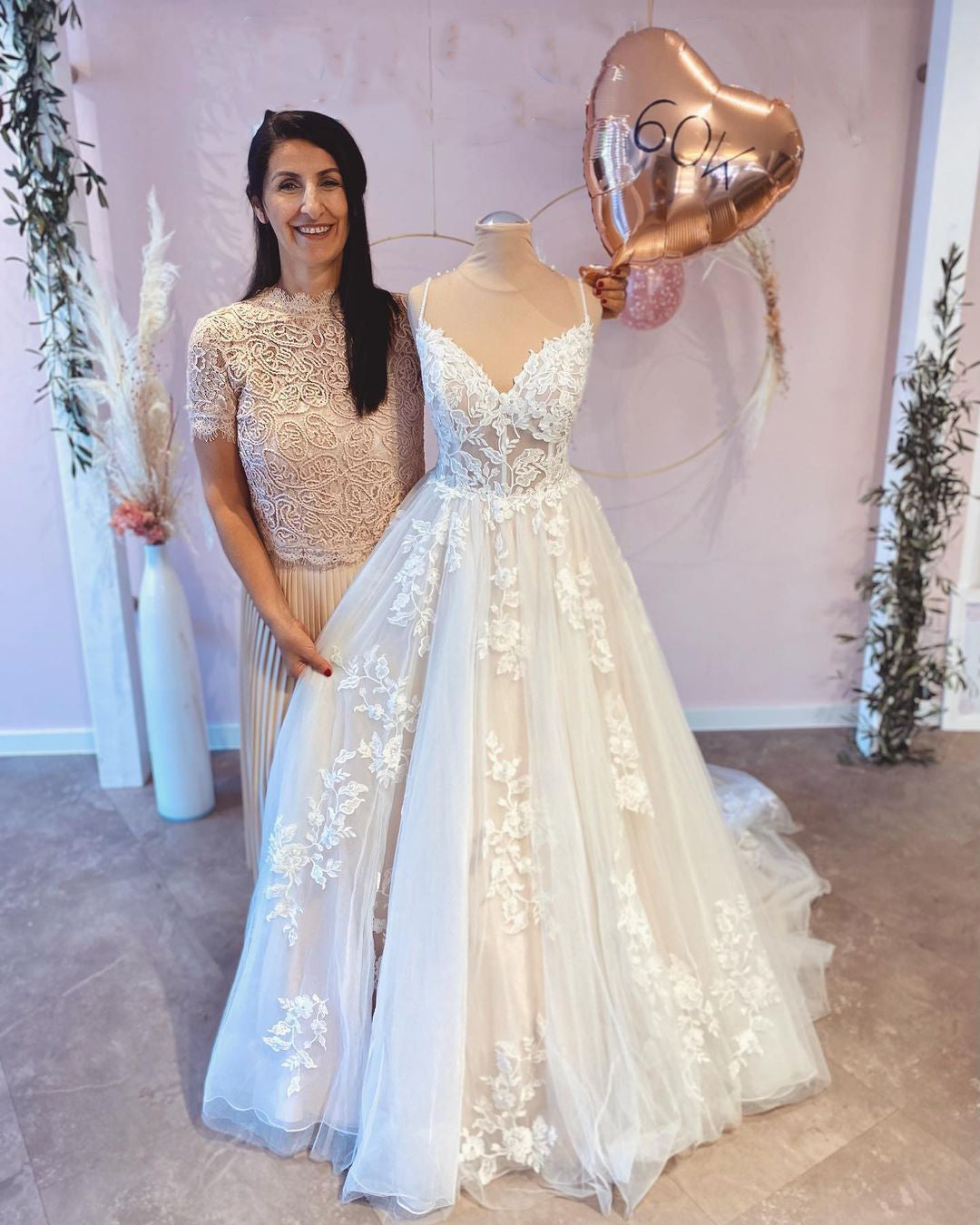 Elegant A-Line Wedding Dress with Spaghetti Straps, Floor-length Train, and Lace Appliques
