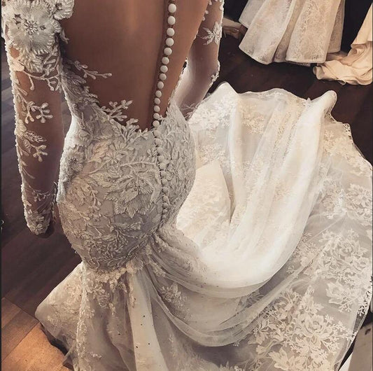 Elegant Sweetheart Mermaid Bridal Gown with Long Sleeves and Tulle Ruffles