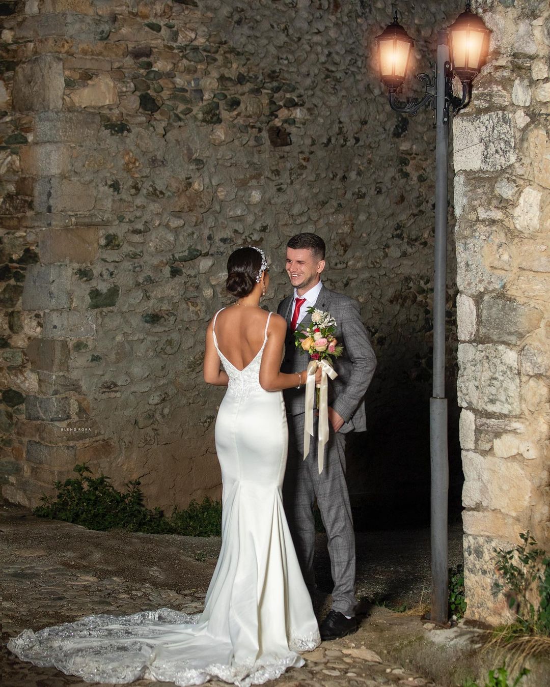 Elegant Mermaid Wedding Gown with Spaghetti Straps, V-neck, and Lace Details
