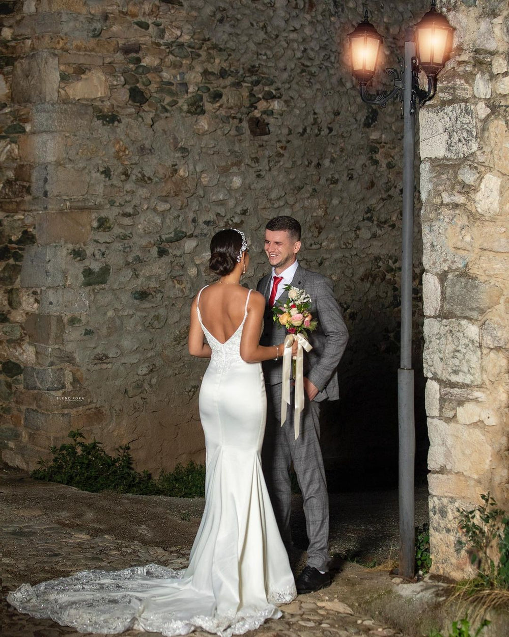 Elegant Mermaid Wedding Gown with Spaghetti Straps, V-neck, and Lace Details