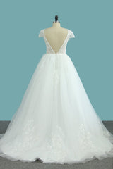 Elegant Floor-length Bateau Wedding Dress with Backless Lace and Tulle Appliques in an A-Line Silhouette