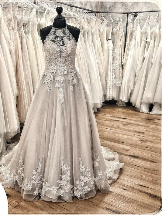 Elegant Backless Halter Wedding Dress with Lace Appliques and Tulle Ruffles