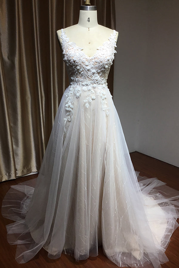Elegant Backless A-line Wedding Dress with Floral Appliques and Chic Straps
