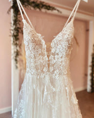 Long A-line Wedding Dress in Lace Tulle with Deep V-neck and Spaghetti-Straps Backless Design