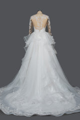 Elegant Long Sleeve Ruffled Ball Gown Wedding Dress Featuring Lace Appliques