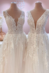 Contemporary A-Line Wedding Gown with Open Back, Lace Train, and Wide Straps Featuring Tulle Appliques