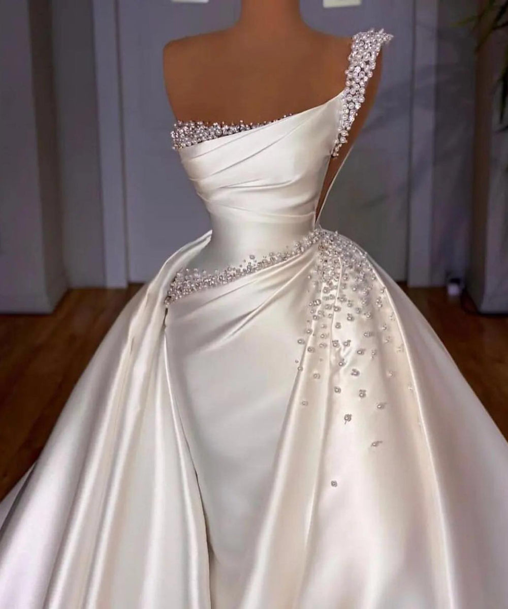 Elegant White Mermaid Bridal Gown with One Shoulder and Pearl-Adorned Detachable Skirt