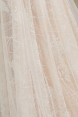 Elegant Long-Sleeve Illusion Wedding Gown in Sheer Tulle with Lace