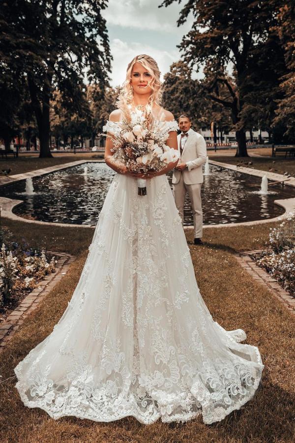 Elegant Off-the-shoulder 3D Floral A-line Wedding Dress with Lace Appliques