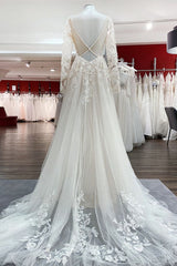 Elegant Ivory A-line Wedding Dress with Long Lace Sleeves and Open Back Tulle Details