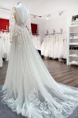 Elegant Ivory A-line Wedding Dress with Long Lace Sleeves and Open Back Tulle Details