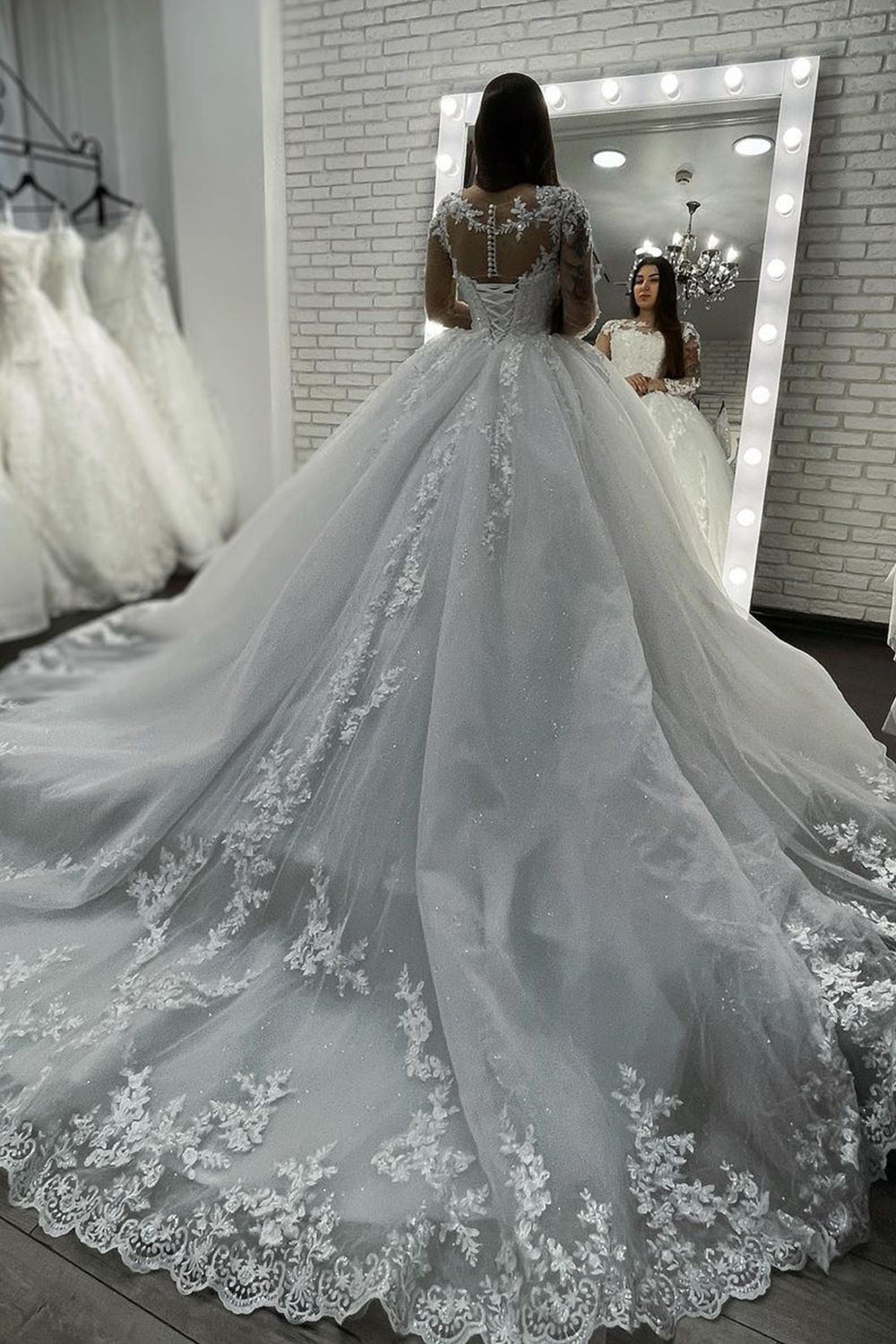 Elegant Long-Sleeve Sheer Tulle Ball Gown Wedding Dress Featuring Appliques
