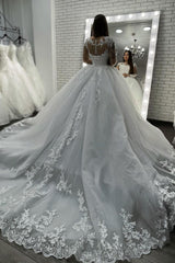 Elegant Long-Sleeve Sheer Tulle Ball Gown Wedding Dress Featuring Appliques