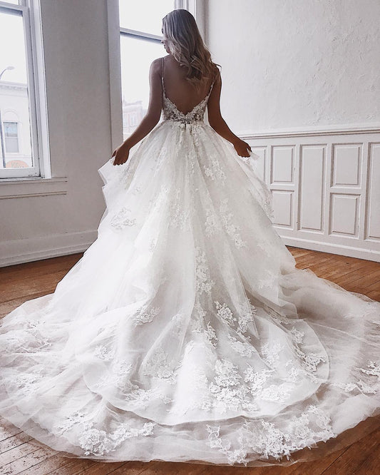 Elegant A-Line Bridal Gowns Featuring Spaghetti Straps and Lace Appliques
