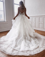 Elegant A-Line Bridal Gowns Featuring Spaghetti Straps and Lace Appliques
