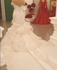 Elegant Off-The-Shoulder Mermaid Wedding Dress with Crystal Details and Backless Design