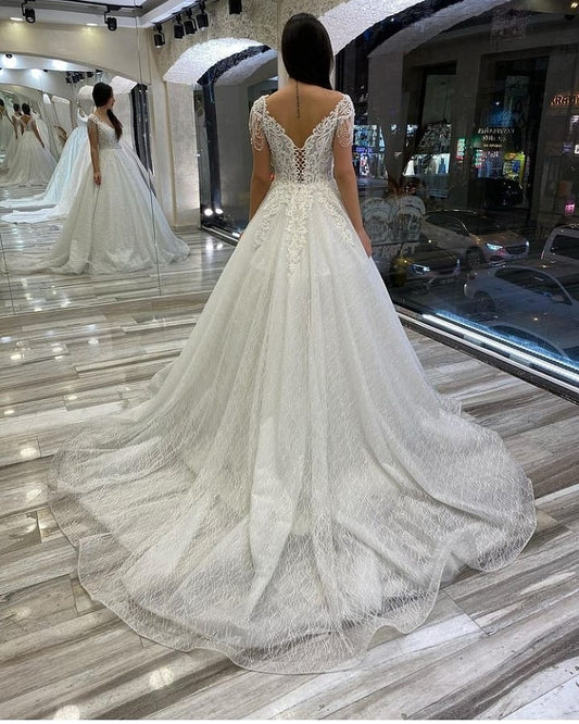 Elegant Sweetheart Backless A-Line Wedding Gown with Sequins, Appliques, and Lace Train