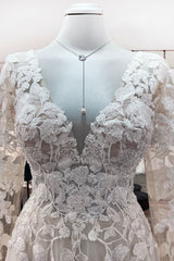 Elegant Ivory A-line Wedding Dress with Long Lace Sleeves and Open Back Tulle Details