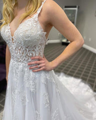 Elegant A-line Wedding Gown with Spaghetti Straps, Deep V-neck, and Lace Appliques on Tulle