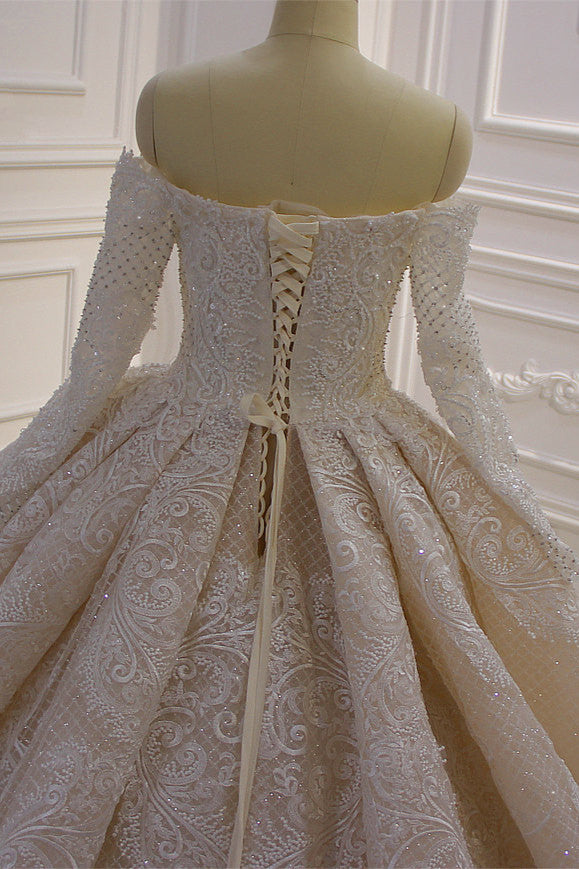 Elegant Off-The-Shoulder Ball Gown Wedding Dress with Lace Appliques and Long Sleeves