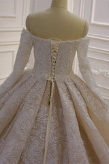 Elegant Off-The-Shoulder Ball Gown Wedding Dress with Lace Appliques and Long Sleeves