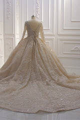 Elegant V-neck Ball Gown with Long Sleeves, Sequins, Beading, and Ruffles