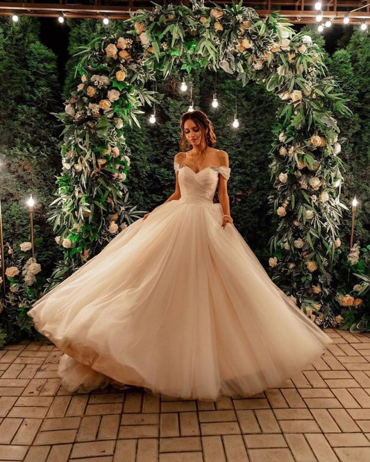 Elegant A-line Long Tulle Wedding Gown with Off-the-shoulder Neckline and Chapel Train