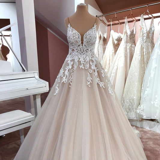 Elegant V-neck A-Line Wedding Gown with Spaghetti Straps, Backless Design, and Appliques Lace Tulle