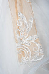 Elegant Long Sleeve Ruffled Ball Gown Wedding Dress Featuring Lace Appliques