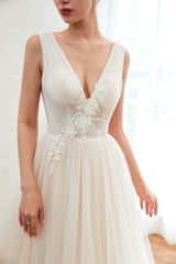 Elegant A-Line Wedding Dress with Deep V-neck and Floor-length Tulle