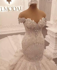Elegant Off-The-Shoulder Mermaid Wedding Dress with Crystal Details and Backless Design