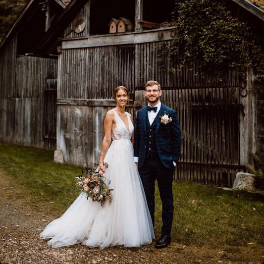Elegant Floral A-Line Wedding Dress with Deep V-neck and Open Back