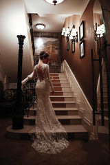Elegant Backless Mermaid Wedding Gown with Vintage High Neck, Long Sleeves, and Lace Appliques