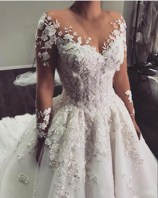 Elegant Floor-length Bateau Wedding Dress with Romantic Lace Appliques and Long Sleeves