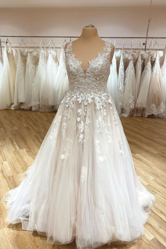 Elegant Deep V-neck A-Line Wedding Gown with Spaghetti Straps, Ruffles, and Lace Appliques on Tulle