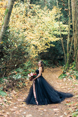 Elegant strapless black A-line wedding gown with lace appliques and tulle