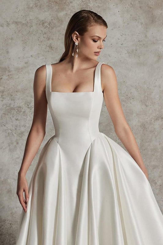 Elegant Ivory Satin A-Line Long Wedding Gown with Spaghetti Straps and Pleated Detail